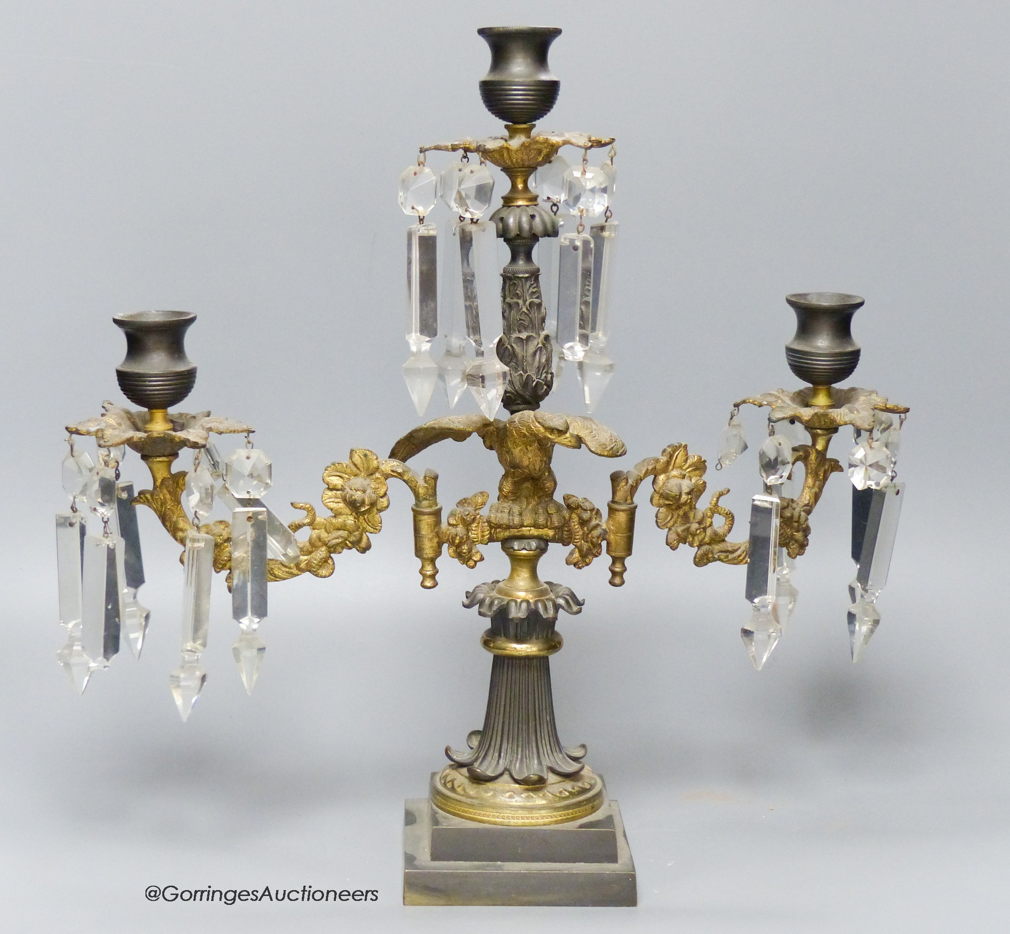 A 19th-century French bronze and ormolu three light candelabrum, 39cm high